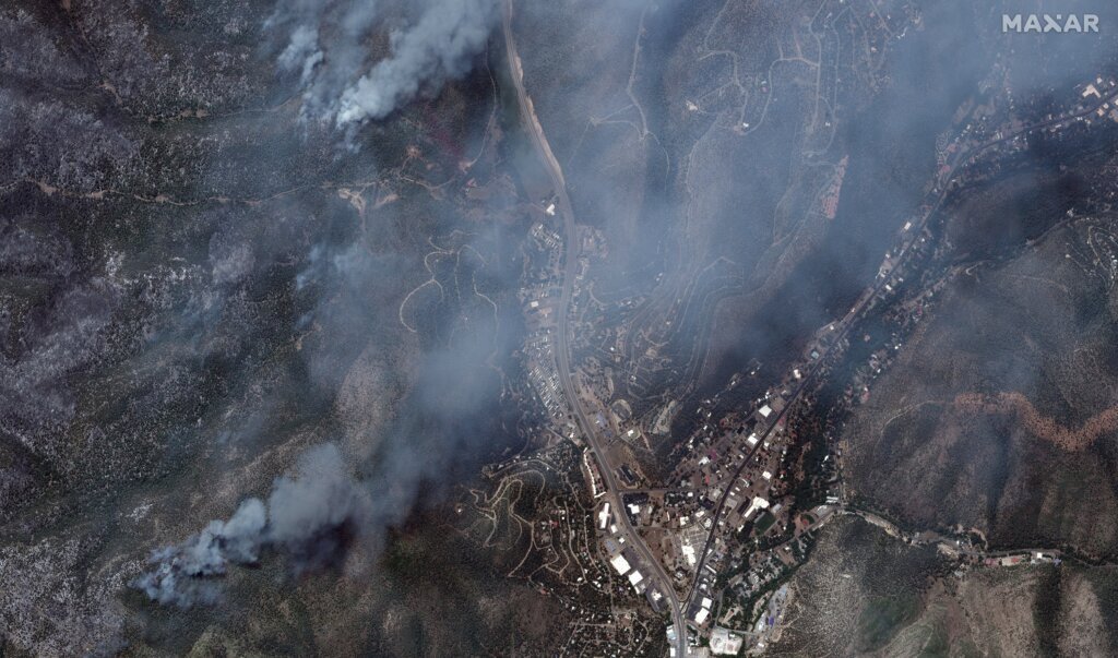 Crews battle deadly New Mexico wildfires as clouds and flooding loom