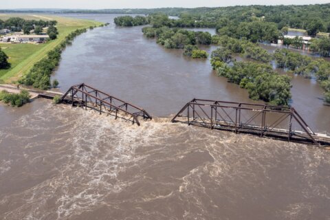 Iowa floodwaters breach levees as even more rain dumps onto parts of the Midwest