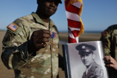 Black D-Day combat medic's long-denied medal tenderly laid on Omaha Beach where he bled, saved lives