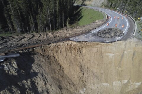 Three weeks after a landslide, Wyoming will reopen a highway critical for commuters