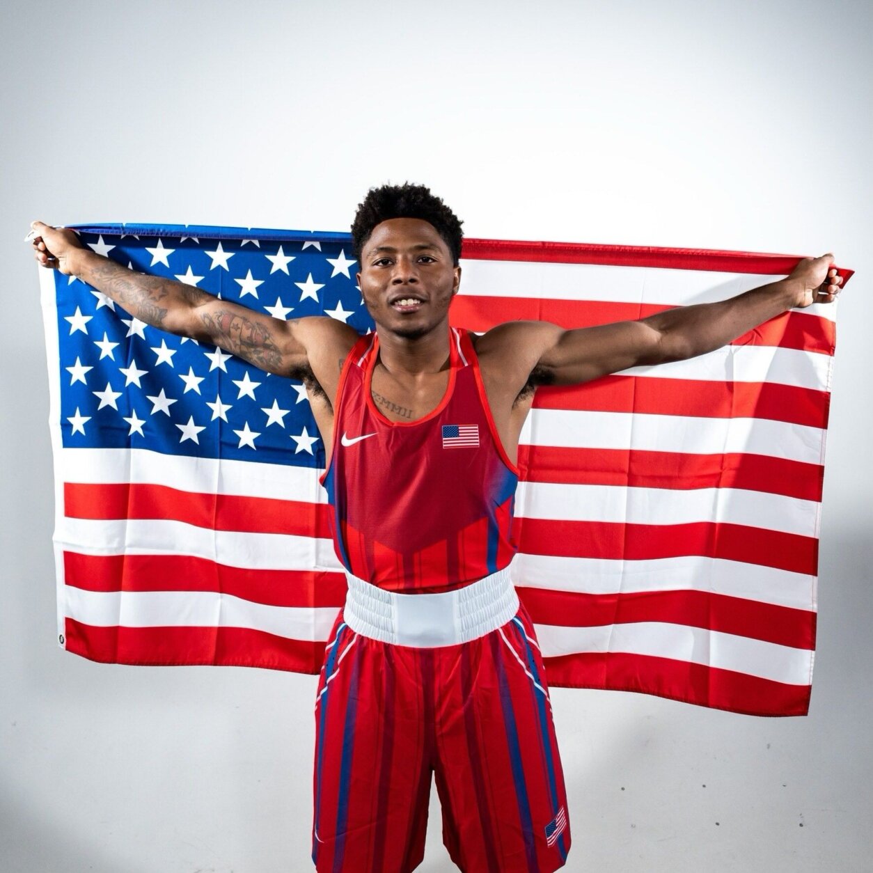 boxer poses with american flag