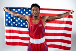 boxer poses with american flag