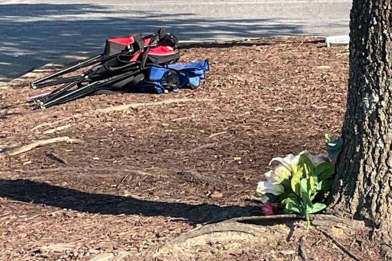 Flowers left at the scene of the shooting. (WTOP/Kyle Cooper)