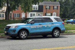 A Prince William County, Virginia, police cruiser is seen near the scene of the shooting in the 3700 block of Masthead Trial. (WTOP/Mike Murillo)