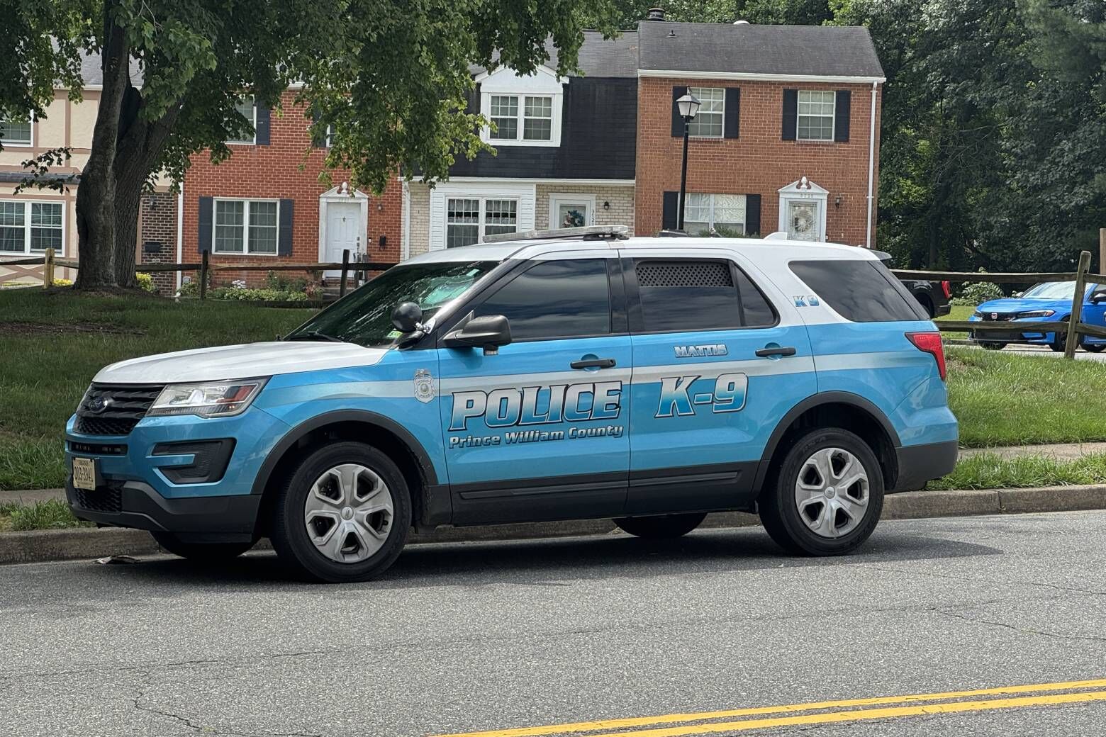 A Prince William County, Virginia, police cruiser is seen near the scene of the shooting in the 3700 block of Masthead Trial. (WTOP/Mike Murillo)