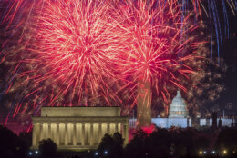 FILE - Fireworks burst on the National Mall above the Lincoln Memorial, Washington Monument and the U.S. Capitol building during Independence Day celebrations in Washington, Monday, July 4, 2022. (AP Photo/J. David Ake, File)