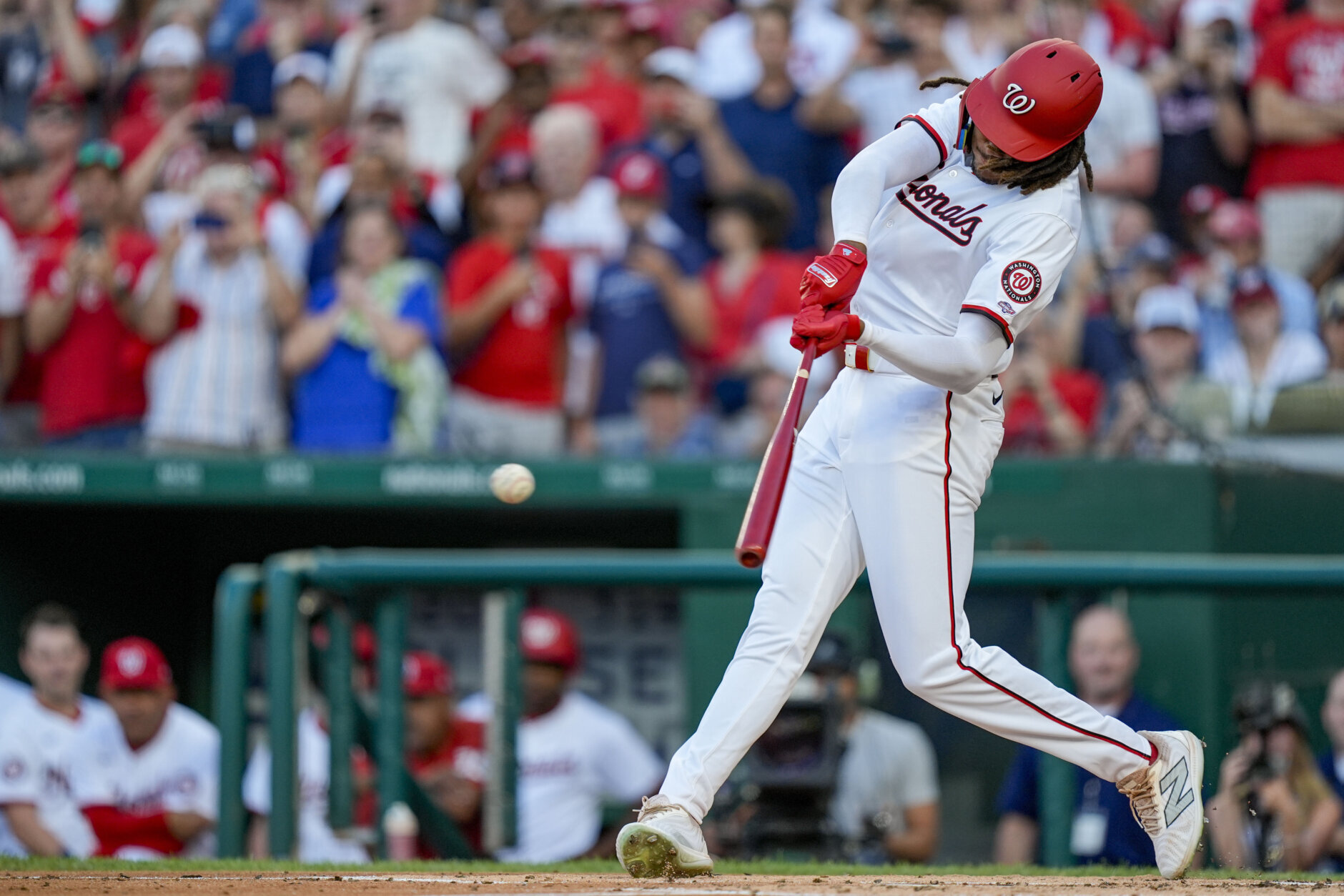 Washington Nationals' James Wood hits a single in his first major league at-bat during the second inning of a baseball game against the New York Mets at Nationals Park, Monday, July 1, 2024, in Washington. (AP Photo/Alex Brandon)