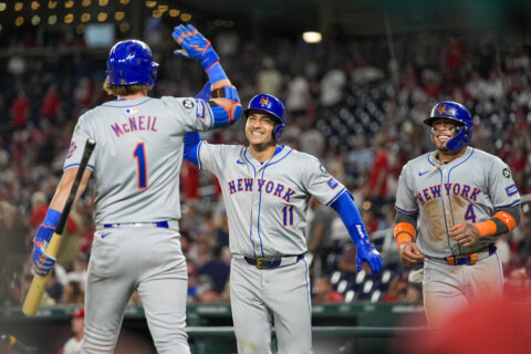 Martinez and Iglesias homer in 6-run 10th and Mets hold off Nationals 9-7 to spoil Wood’s debut