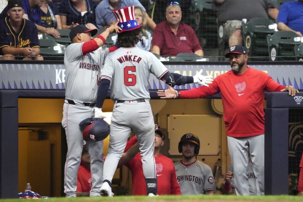 Rutledge makes 1st major league start, the Nationals beat the Brewers to end 5-game losing streak.