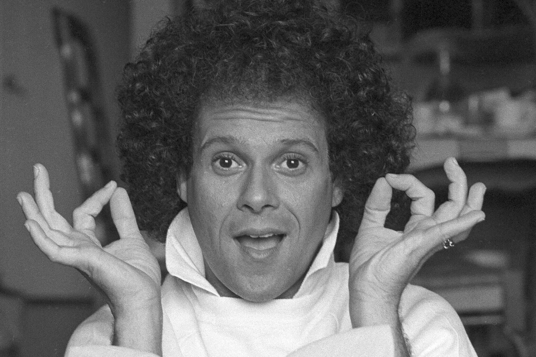 FILE - Richard Simmons sits for a portrait in Los Angeles, June 23, 1982. Simmons, a fitness guru who urged the overweight to exercise and eat better, died Saturday, July 13, 2024, at the age of 76. (AP Photo/Richard Drew, File)