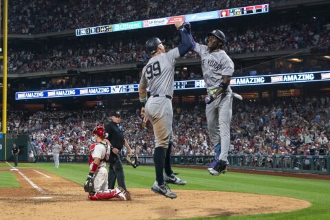 Chisholm's second straight 2-homer game helps Yanks top Phils 7-6 in 12 innings for 4th straight win