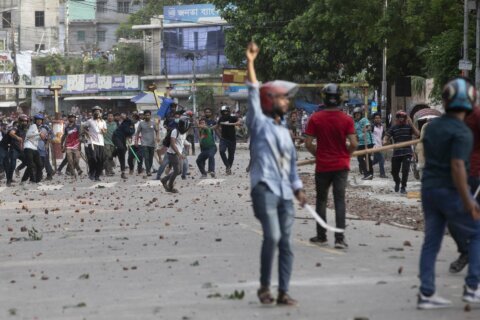 Bangladesh’s government raids opposition HQ and asks universities to close after 6 die in protests