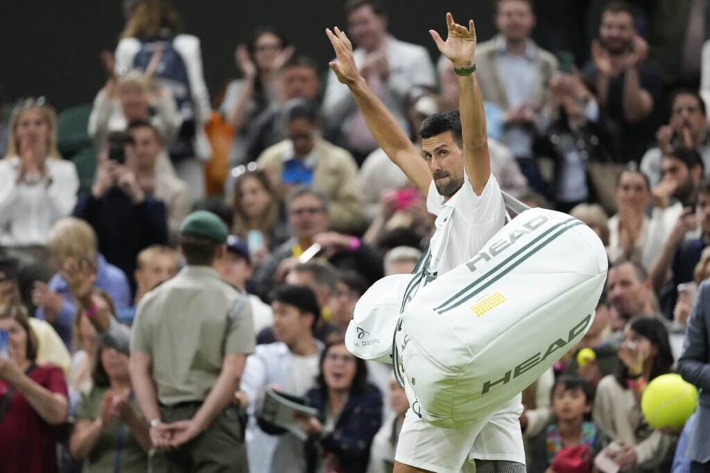 Novak Djokovic reaches a record 13th Wimbledon semifinal when an injured Alex de Minaur withdraws