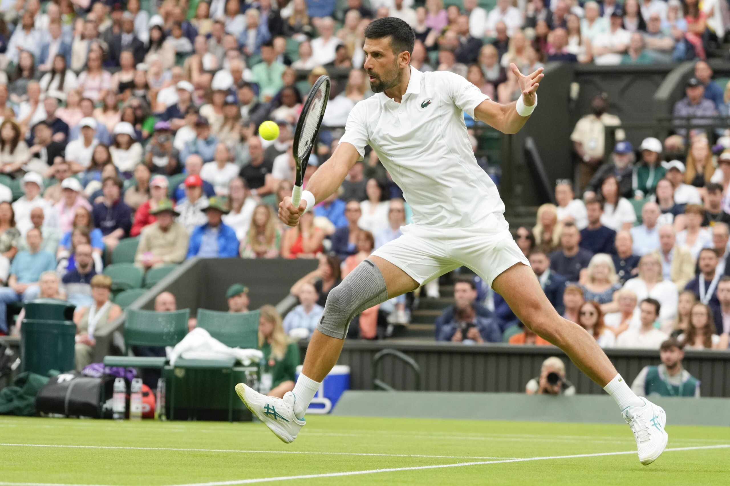 Novak Djokovic wins his first match at Wimbledon with a sleeve on his ...