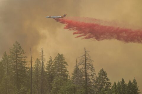 California man defends his home as wildfires push devastation and spread smoke across US West