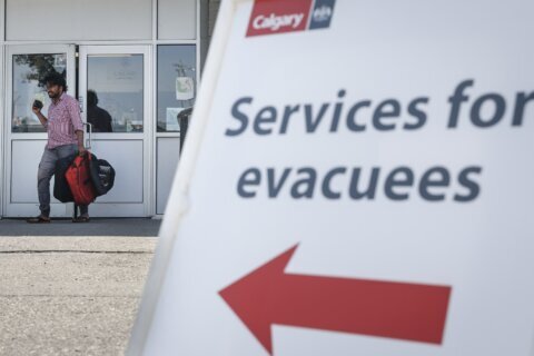 Park rangers in Canada search for stragglers in evacuation zone of two big wildfires