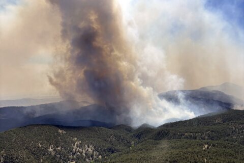 1 person killed in Colorado wildfires as blazes torch large areas of the U.S. West