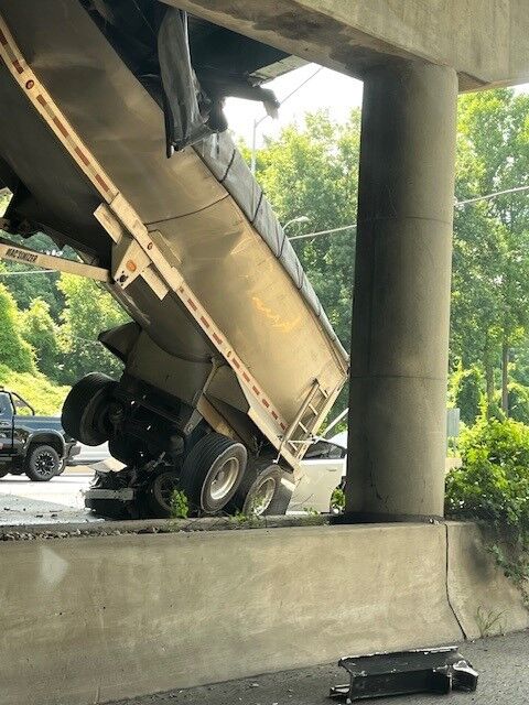 Dumpster truck crashes into bridge support on I-495