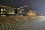 Freight train cars derail, striking wall that collapsed garage buildings in Fredericksburg, Va.