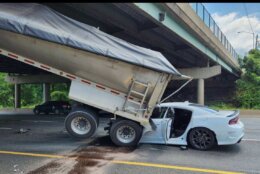 Dumpster truck crashes into bridge support on I-495