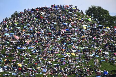 Fans swarm hill in Munich, claiming a high perch for watching Taylor Swift concert for free