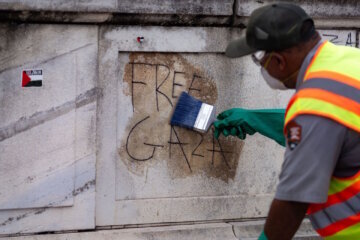WASHINGTON, DC - JULY 25: National Park Service workers attempt to remove graffiti at Union Station on July 25, 2024 in Washington, DC. The flags were removed during the protests surrounding Israeli Prime Minister Benjamin Netanyahu's address to a joint meeting of Congress which occured as the Israel Hamas war inches closer to a ten month anniversary. (Photo by Kent Nishimura/Getty Images)