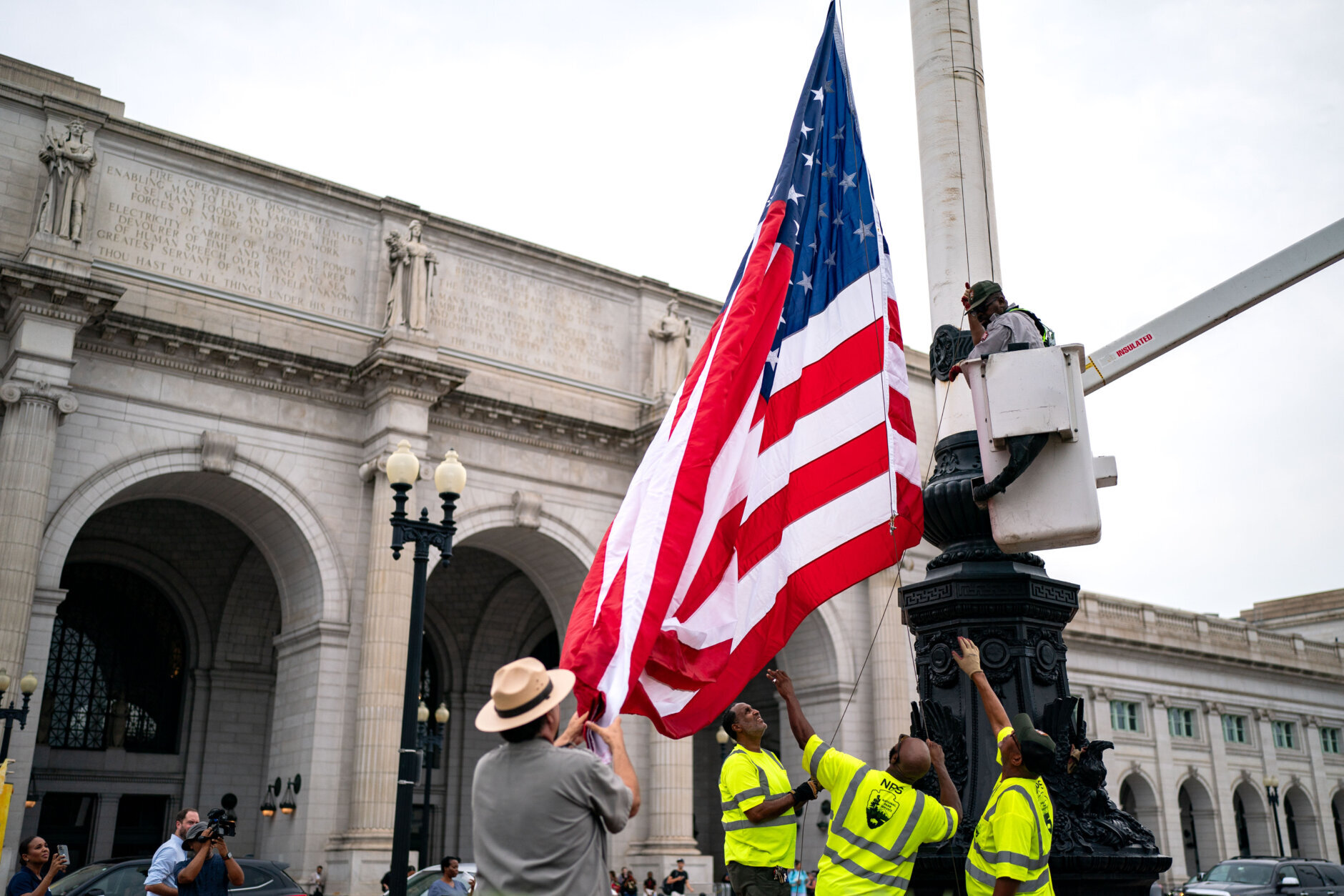 WASHINGTON, DC - JULY 25: National Park Service workers replace one of the flags fronting Union Station on July 25, 2024 in Washington, DC. The flags were removed during the protests surrounding Israeli Prime Minister Benjamin Netanyahu's address to a joint meeting of Congress which occured as the Israel Hamas war inches closer to a ten month anniversary. (Photo by Kent Nishimura/Getty Images)