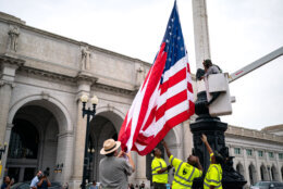WASHINGTON, DC - JULY 25: National Park Service workers replace one of the flags fronting Union Station on July 25, 2024 in Washington, DC. The flags were removed during the protests surrounding Israeli Prime Minister Benjamin Netanyahu's address to a joint meeting of Congress which occured as the Israel Hamas war inches closer to a ten month anniversary. (Photo by Kent Nishimura/Getty Images)