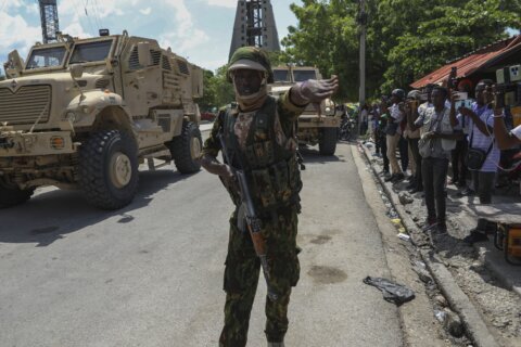 Haiti’s prime minister orders gangs to drop weapons and promises to take back control of the capital