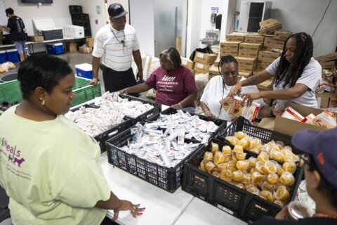 Houston community groups strain to keep feeding and cooling a city battered by repeat storms