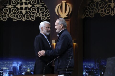 Iran holds runoff presidential vote pitting hard-line former negotiator against reformist lawmaker