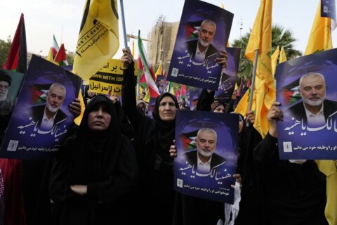 Iran’s supreme leader prays over the coffin of Hamas leader Haniyeh, whose killing risks a wider war