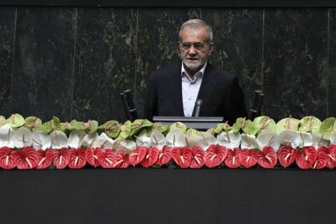 Iran’s new president is sworn in and pledges to keep trying to remove Western sanctions