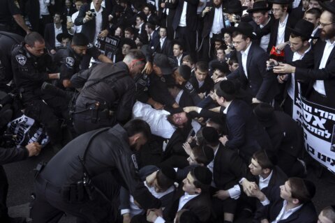 Israeli military says it will begin drafting ultra-Orthodox men. That could rattle the government