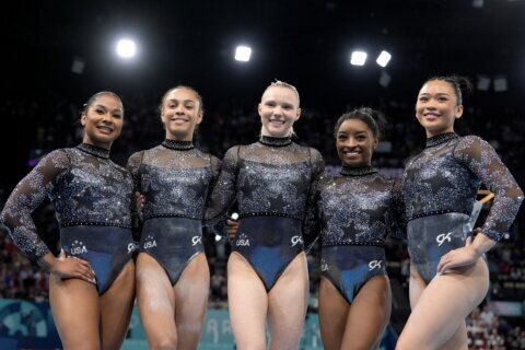 The Latest: Simone Biles and US compete in Olympic gymnastics women’s team final