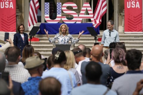 Jill Biden meets with US Olympic athletes in Paris — and even helps with a relay drill