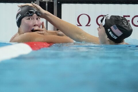 American swimmer and Arlington native Torri Huske edges teammate Gretchen Walsh by just .04 seconds in 100 butterfly