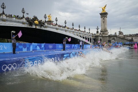 Olympic triathletes swim in Seine River after days of concerns about water quality