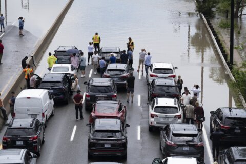 Torrential rains hit Canada’s largest city, closing a major highway and other roads