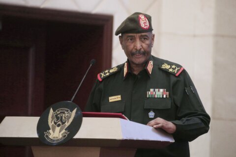 Sudan’s military says its top commander survived a drone strike that killed 5 at an army ceremony