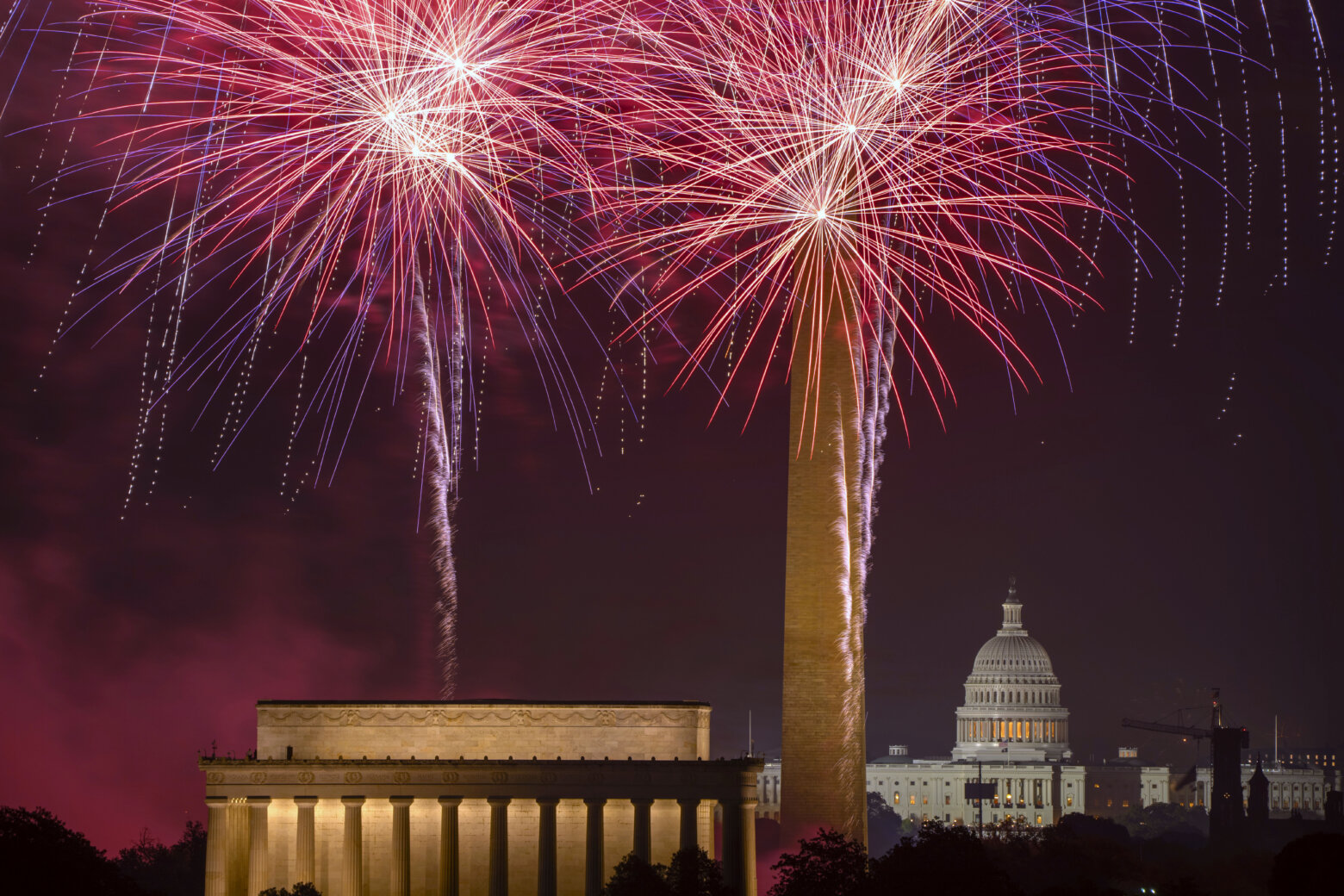 Fireworks burst above the National Mall