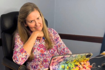 Virginia Rep. Jennifer Wexton sitting with a tablet in front of her.