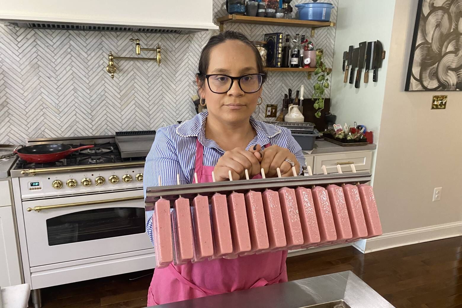 "What really differentiates the paleta from a traditional popsicle is the craftsmanship that goes into making each one of our pops," Jarabe Gourmet Pops' owner Diana Rios Jasso says. (WTOP/John Domen)