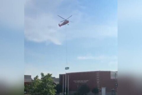 Pretty cool: Helicopters deliver massive air conditioning units to roofs of 2 Virginia high schools