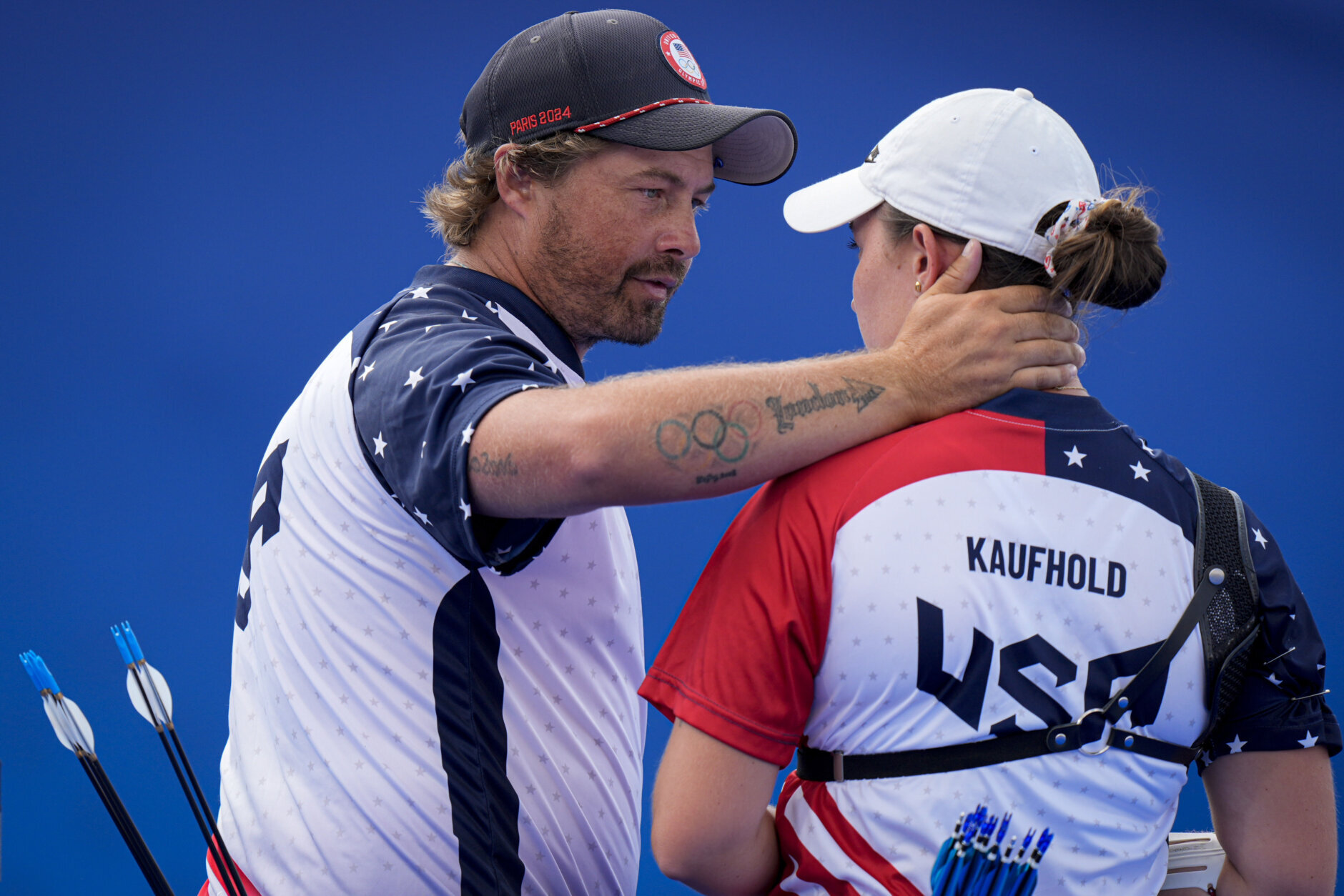 Brady Ellison, of the United States, left, celebrates after defeating, along with Casey Kaufhold, of the United States, Japan's Satsuki Noda and Japan's Junya Nakanishi during the Archery mixed team quarterfinal at the 2024 Summer Olympics, Friday, Aug. 2, 2024, in Paris, France. (AP Photo/Brynn Anderson)