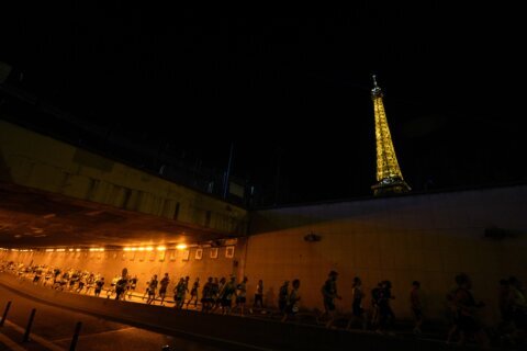 Amateur runners race like Olympians along the same iconic route as competitors in Paris