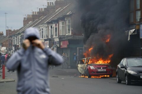 Man who encouraged torching hotels for asylum seekers in Britain gets 3 years in prison