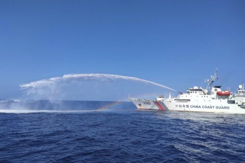 Chinese coast guard ships fire water cannons and block Philippine fisheries vessel in disputed sea