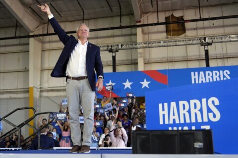 Walz touts Nebraska roots in visit to his home state where there's a battle over one electoral vote