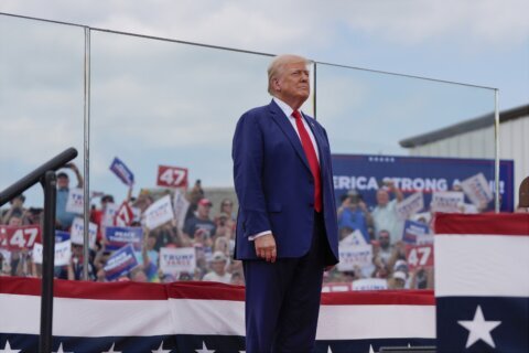 Trump speaks from behind bulletproof glass at first outdoor rally since his attempted assassination